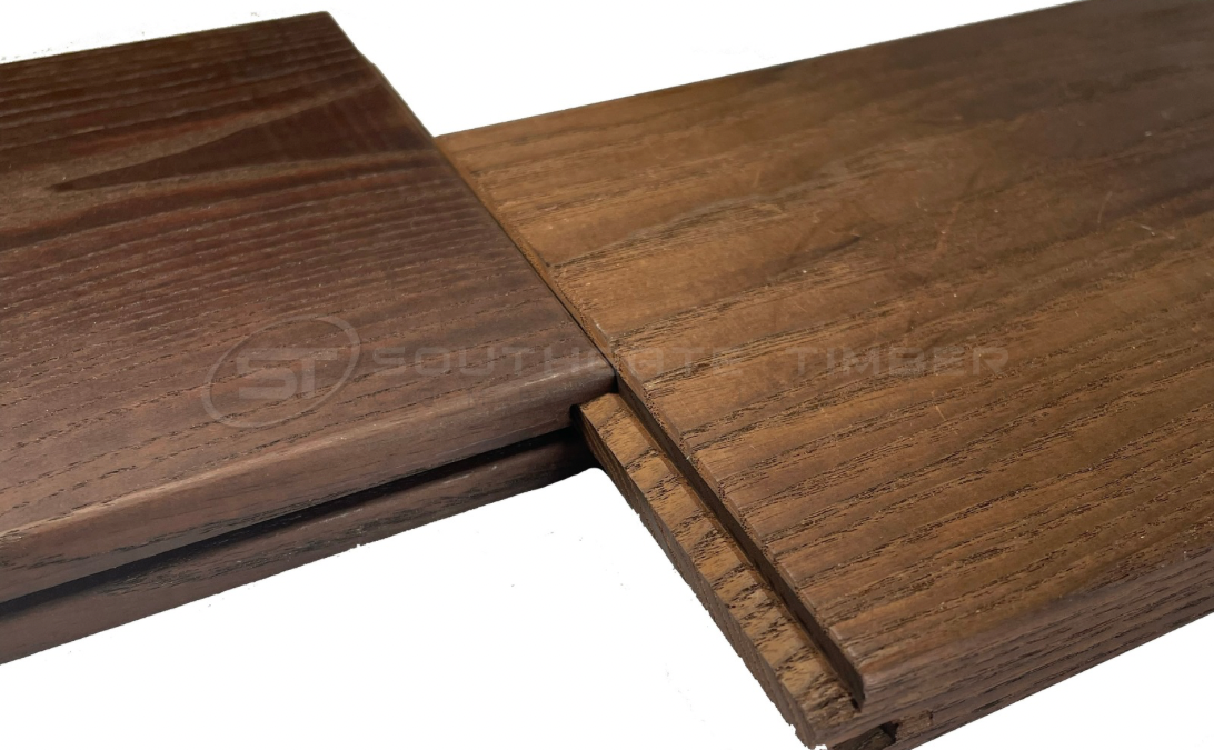 Close-up of Thermo Ash decking boards with end-matched profile, highlighting precise jointing that competes with composite decking for stability, ease of installation, and minimal waste.