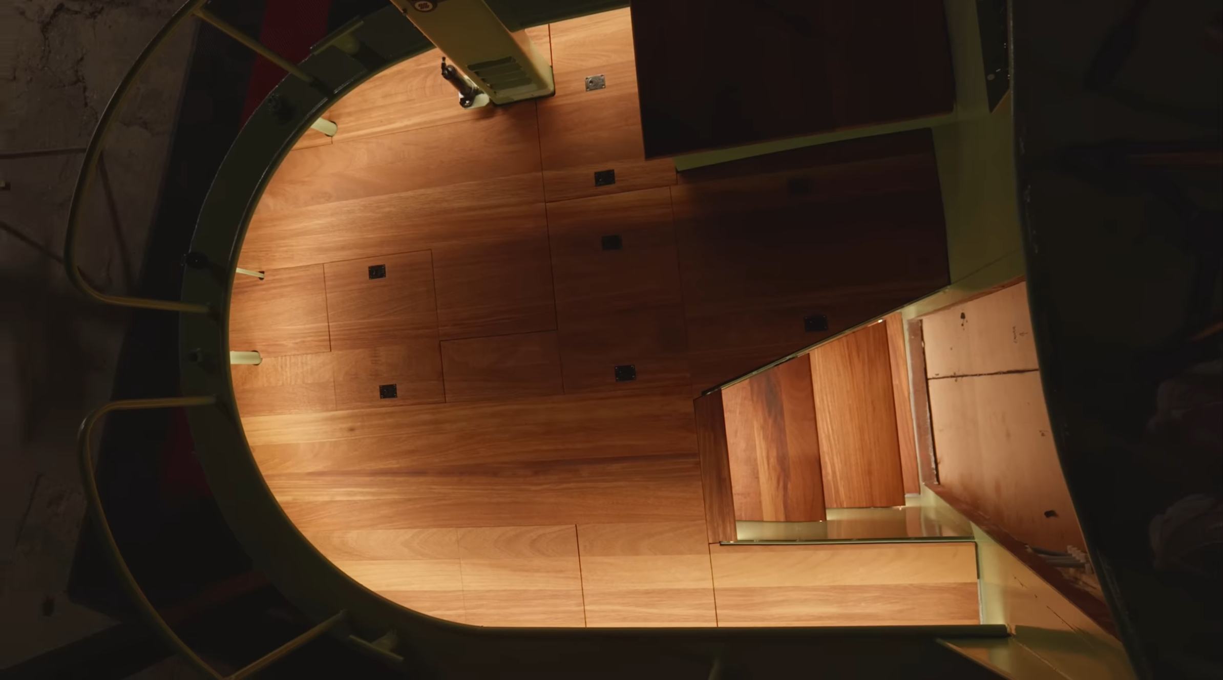 Overhead view of Iroko hardwood tongue and groove decking installed on the narrowboat by The Home Improvements Channel, with bespoke machining supplied free of charge by Southgate Timber.