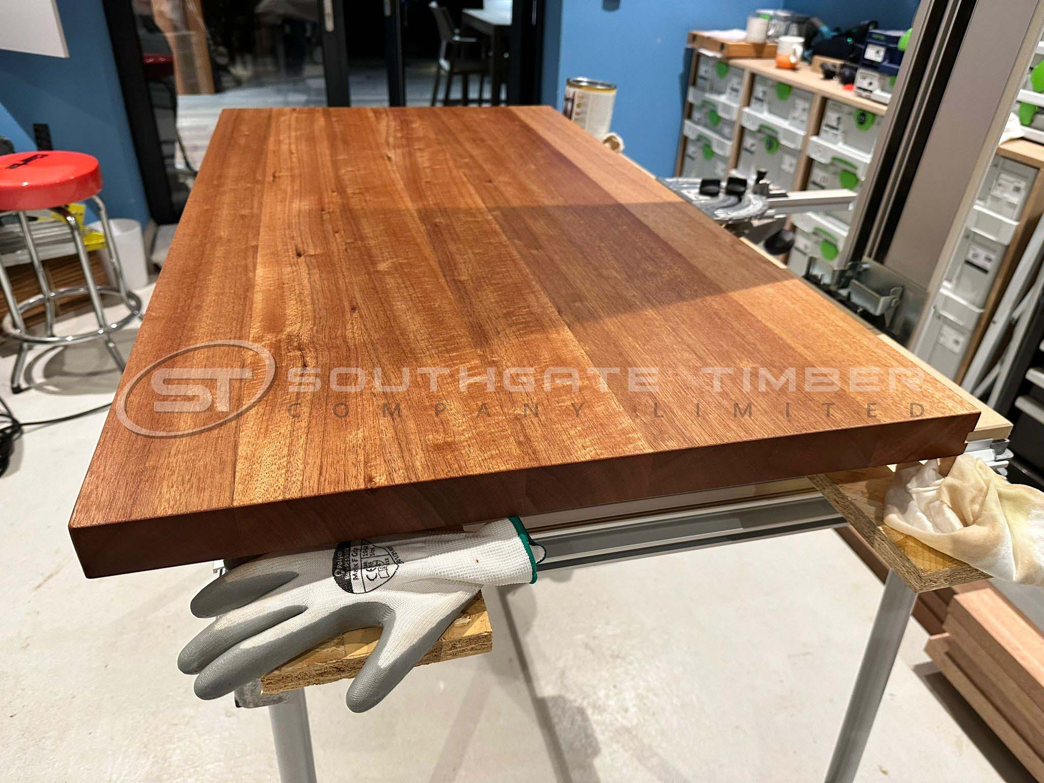 Meranti Far Eastern Hardwood 45 x 95mm P.A.R timber board on a workshop bench, displaying its rich natural colour, fine grain, and precision-machined edges supplied by Southgate Timber.