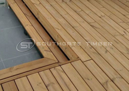 Thermowood pine decking with clean linear boards and mitred detail, showcasing a durable, budget-friendly alternative to hardwood decking.