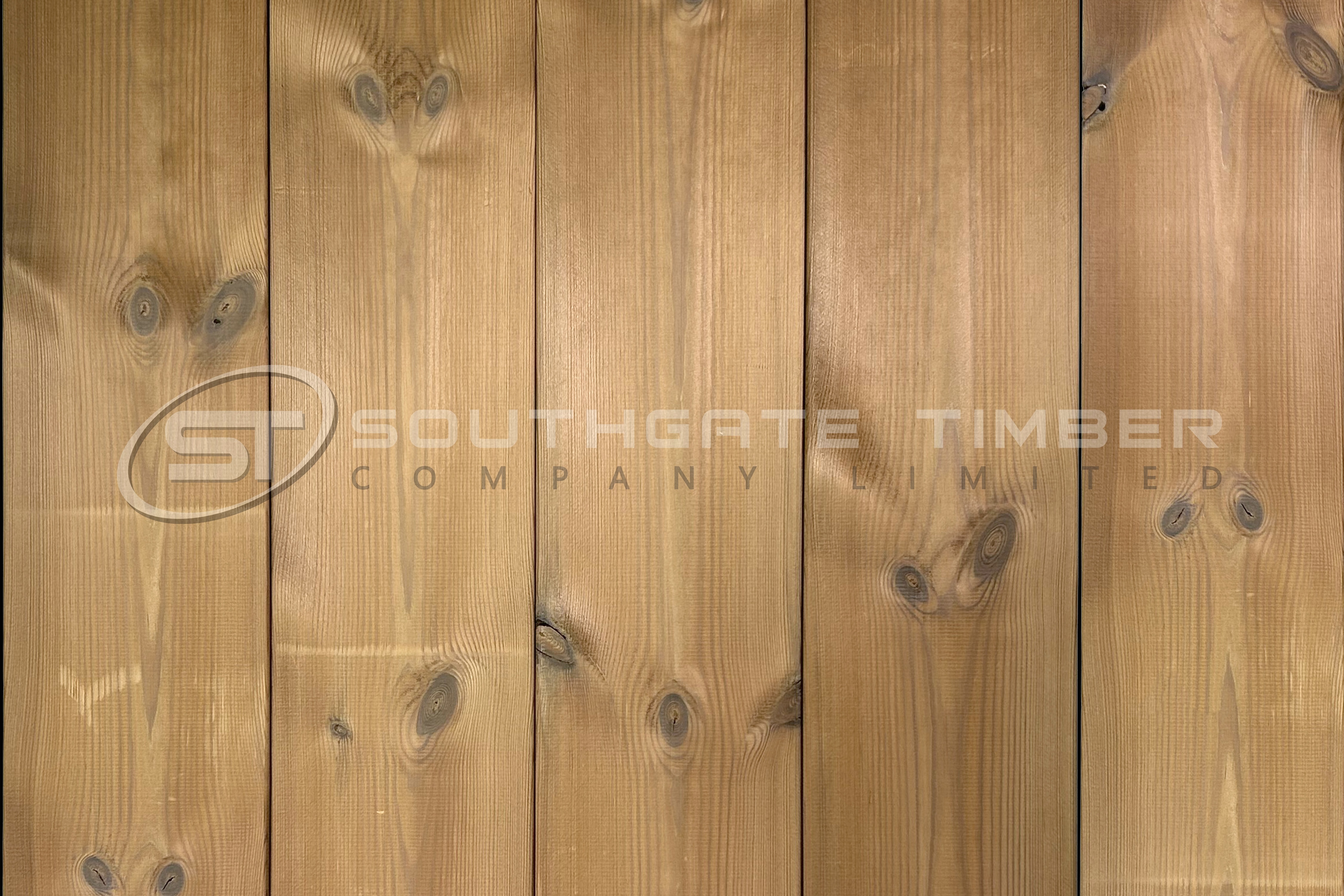 Thermowood pine cladding with natural knots and warm golden tones, highlighting a cost-effective, durable alternative to traditional timber cladding.