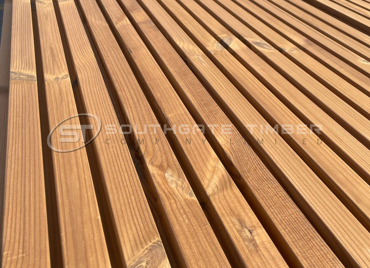 Thermowood pine fencing boards showing consistent spacing, enhanced durability, and stability for year-round outdoor use.