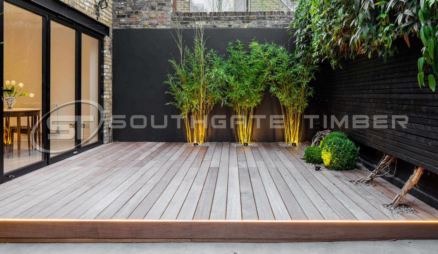 Tropical hardwood, Iroko decking smooth 20 x 140mm. Exotic gardens design with exterior decking outside kitchen 