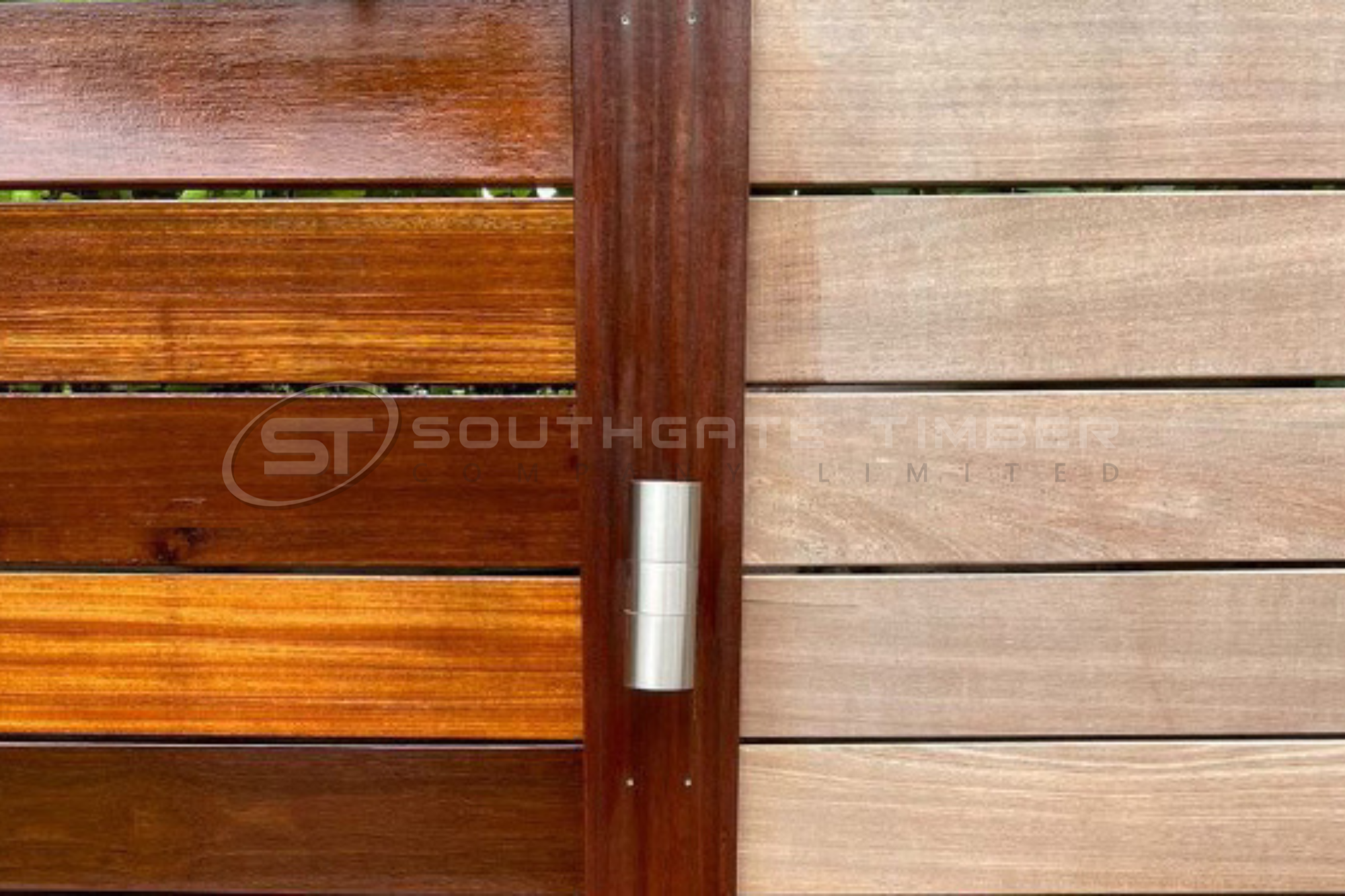 Comparison of treated and untreated timber fencing showing the colour difference and natural weathering process over time
