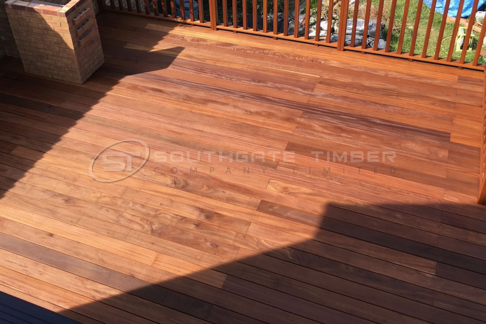 Ipe hardwood decking installed in a garden showing natural colour variation and premium finish