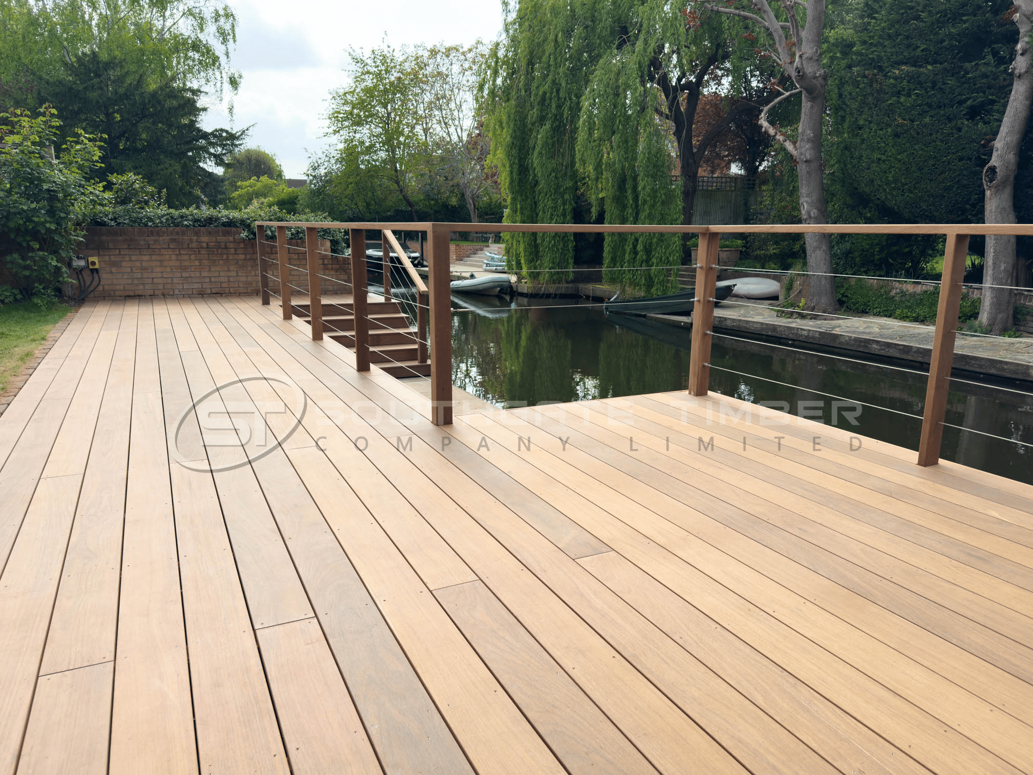 Ipe hardwood decking installed in a modern waterfront garden project with clean contemporary design