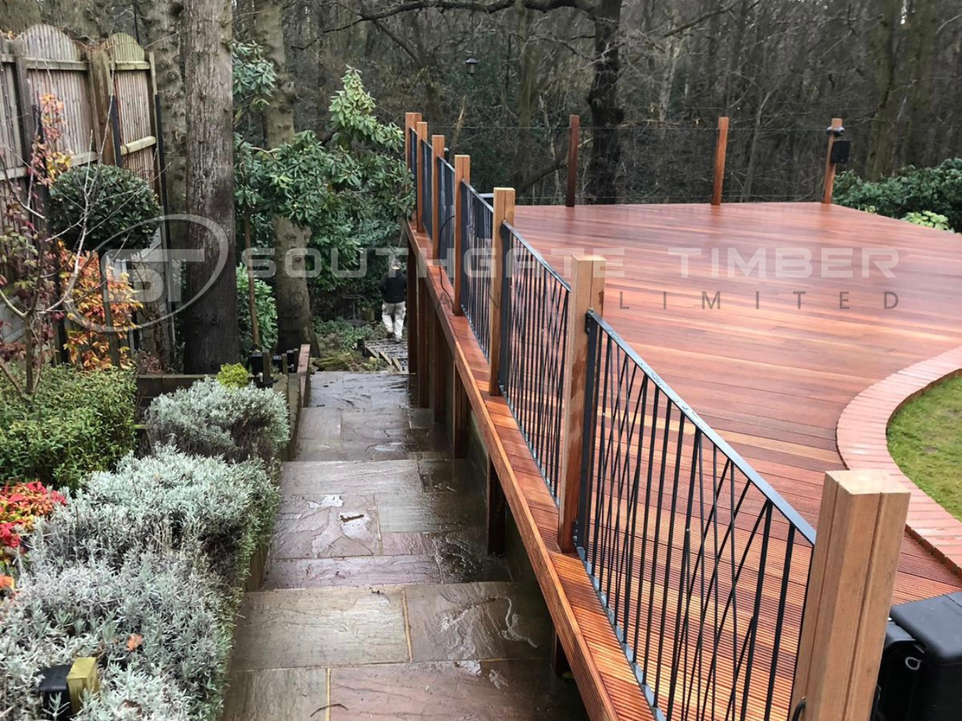     Elevated hardwood decking installation showing board spacing and ventilation for moisture control