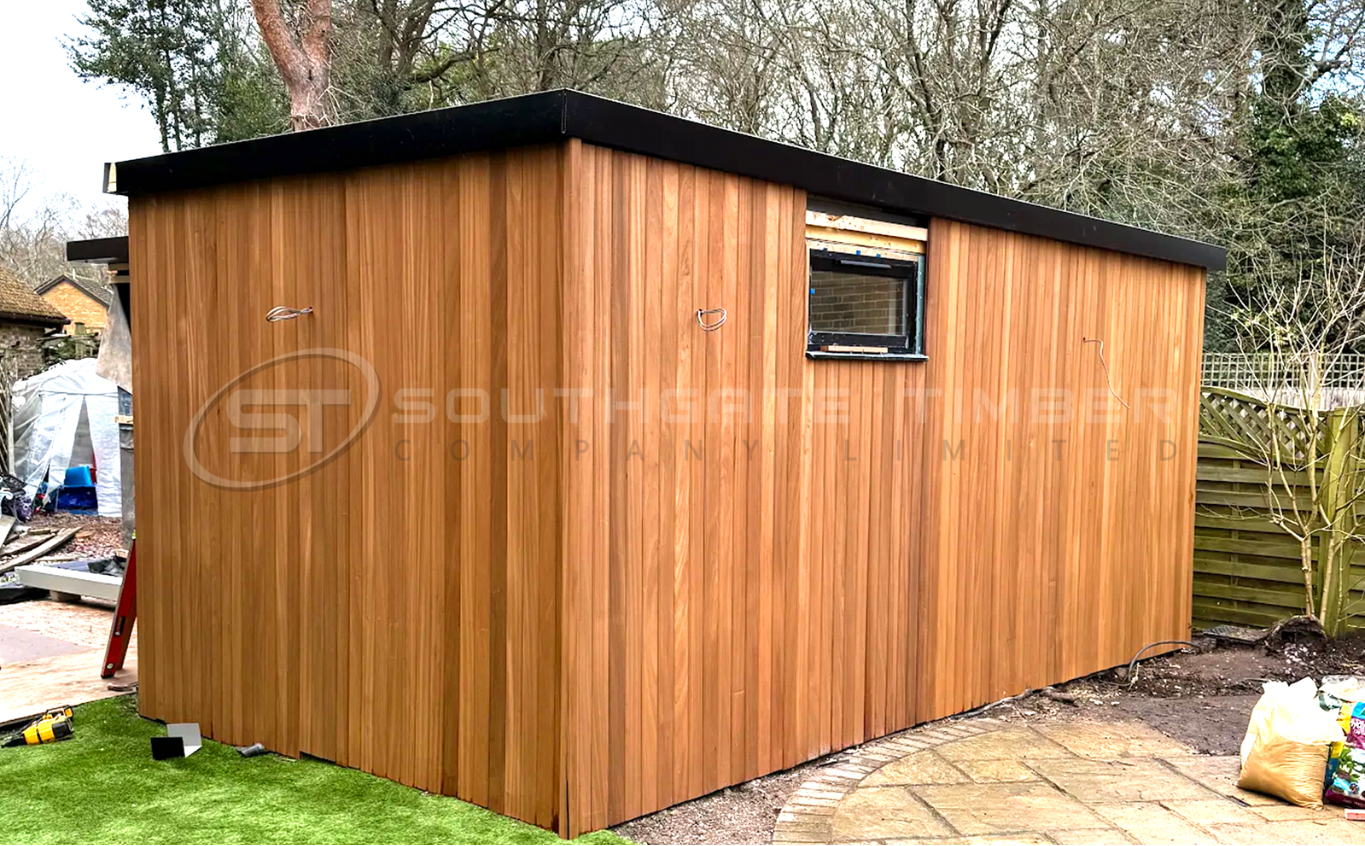 Thermo Ayous cladding on garden room exterior with uniform grain and warm colour, a lightweight alternative to thermo-ash cladding