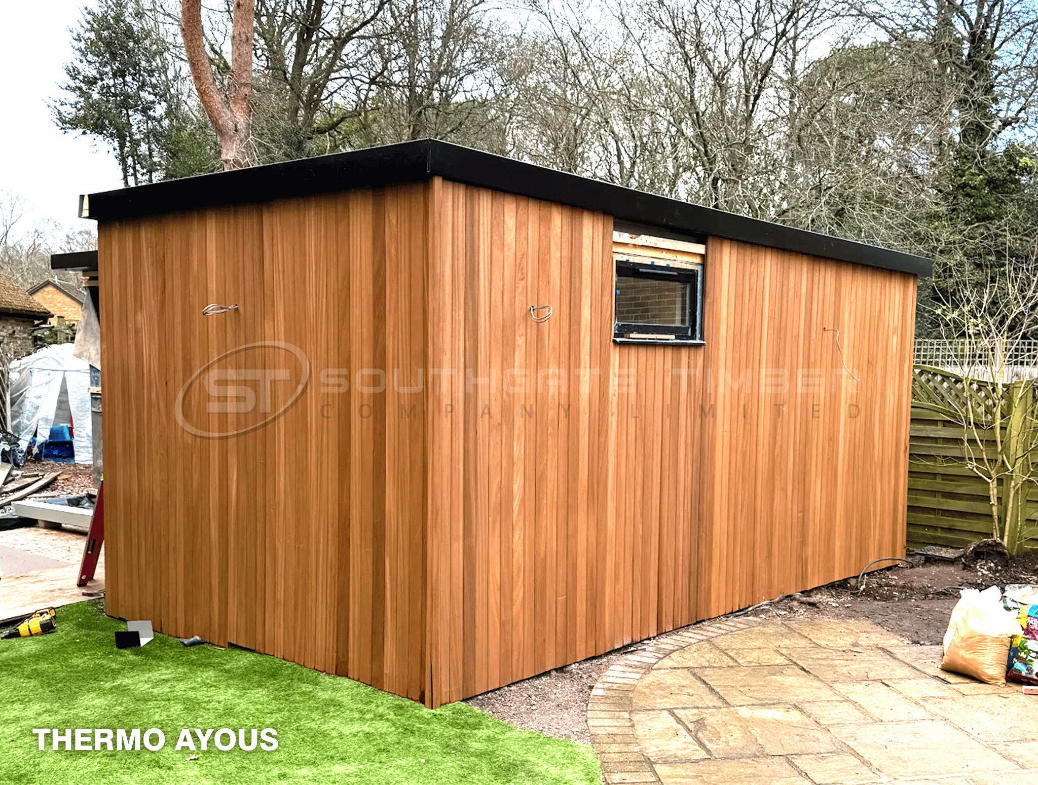 Thermally modified Thermo Ayous cladding on a garden room, a lower-cost alternative to Western Red Cedar