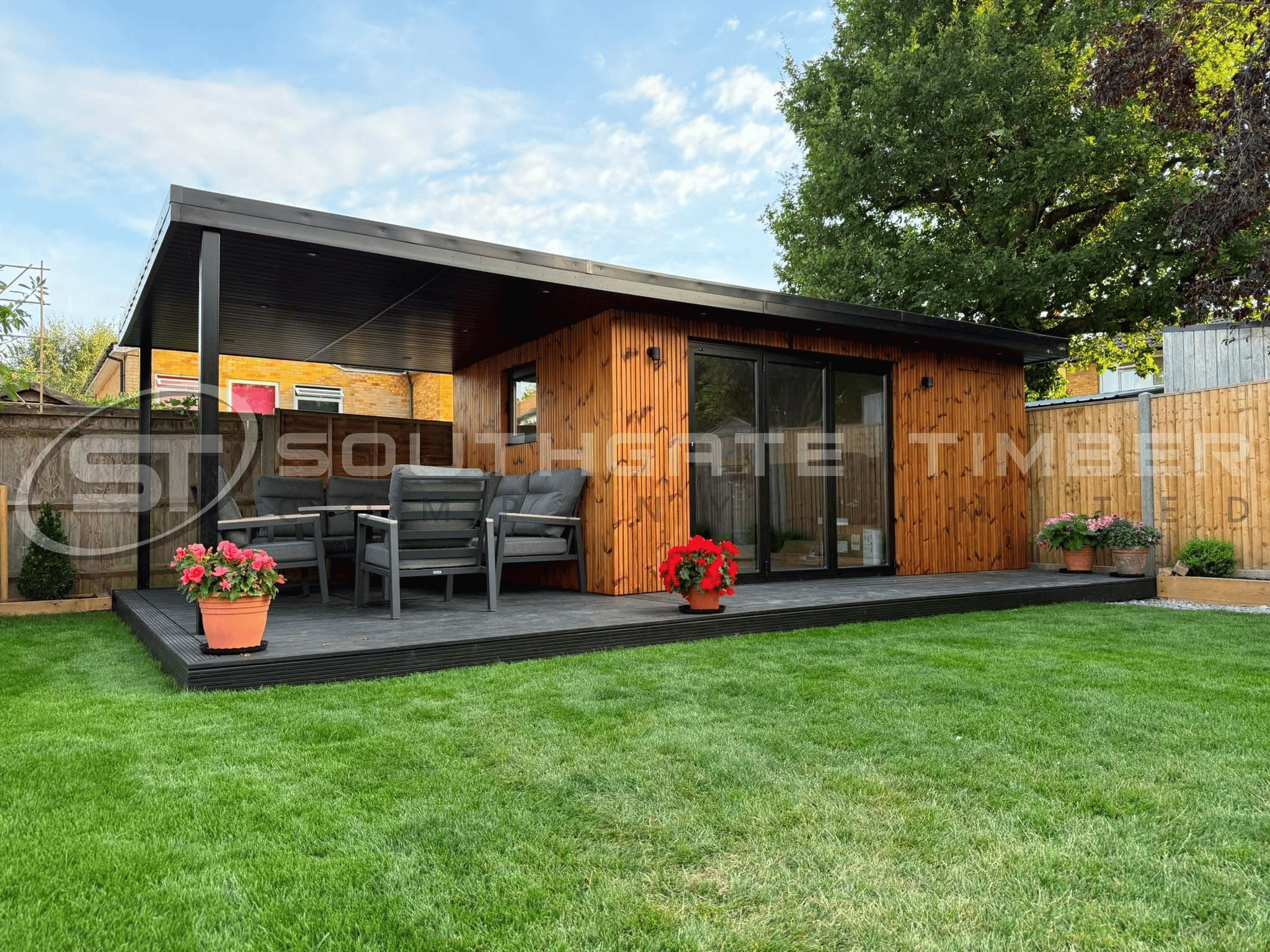 Thermowood Pine cladding installed vertically on a contemporary garden room