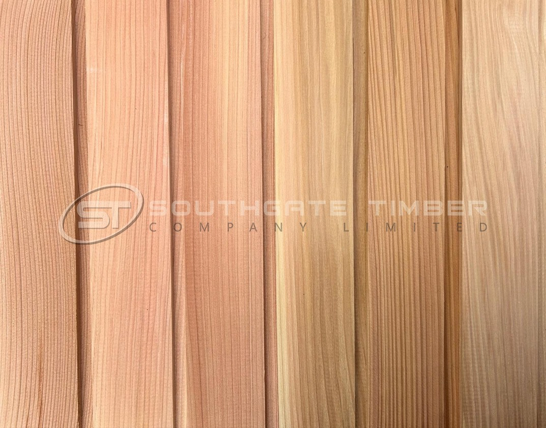 Close-up of Western Red Cedar cladding showing natural grain patterns, colour variation and timber character.