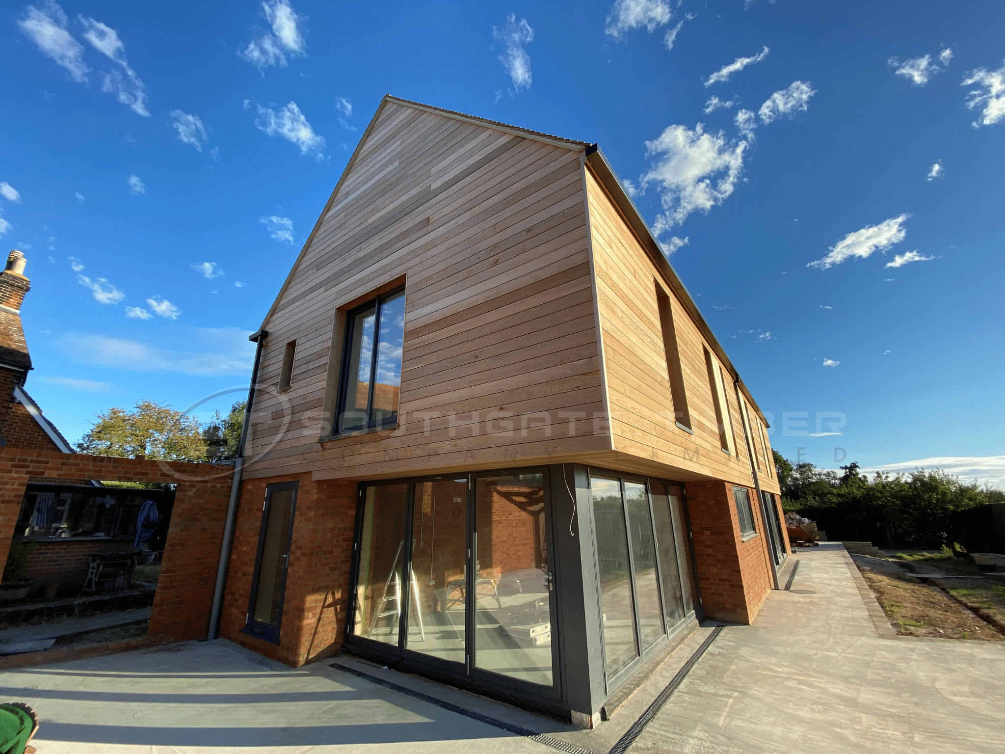 Western Red Cedar timber cladding on contemporary brick and timber house exterior with natural warm finish